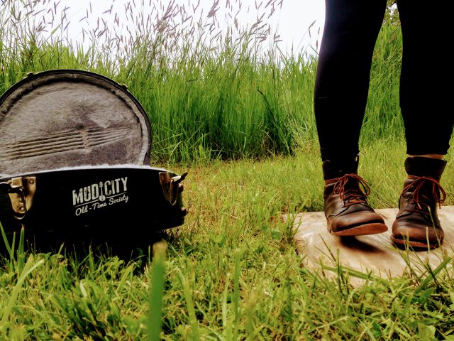 Flatfoot dancing next to banjo case